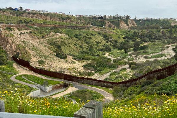 A canyon collector (lower left) of the South Bay International Wastewater Treatment Plant, San Diego nearby the old border fence seen on March 14, 2023. The Canyon Collector operates on rainy days to filter out trash carried by rainwater from Mexico. (Jane Yang/The Epoch Times)