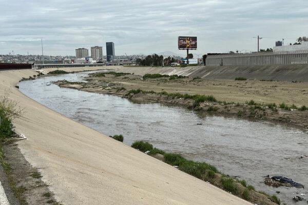 Raw sewage and trash flow down the Tijuana River in San Diego on Mar. 14, 2023. (Jane Yang/The Epoch Times)