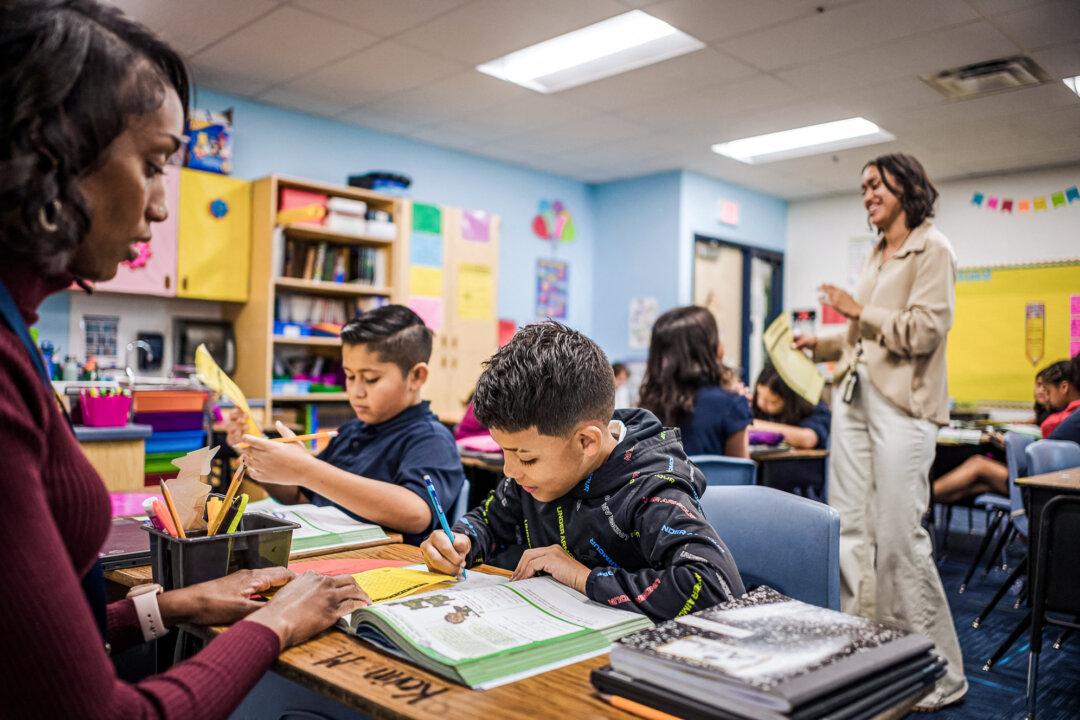 Students work on assignments in class at Nevitt Elementary School in Phoenix on Oct. 26, 2022. (Olivier Touron/AFP via Getty Images)