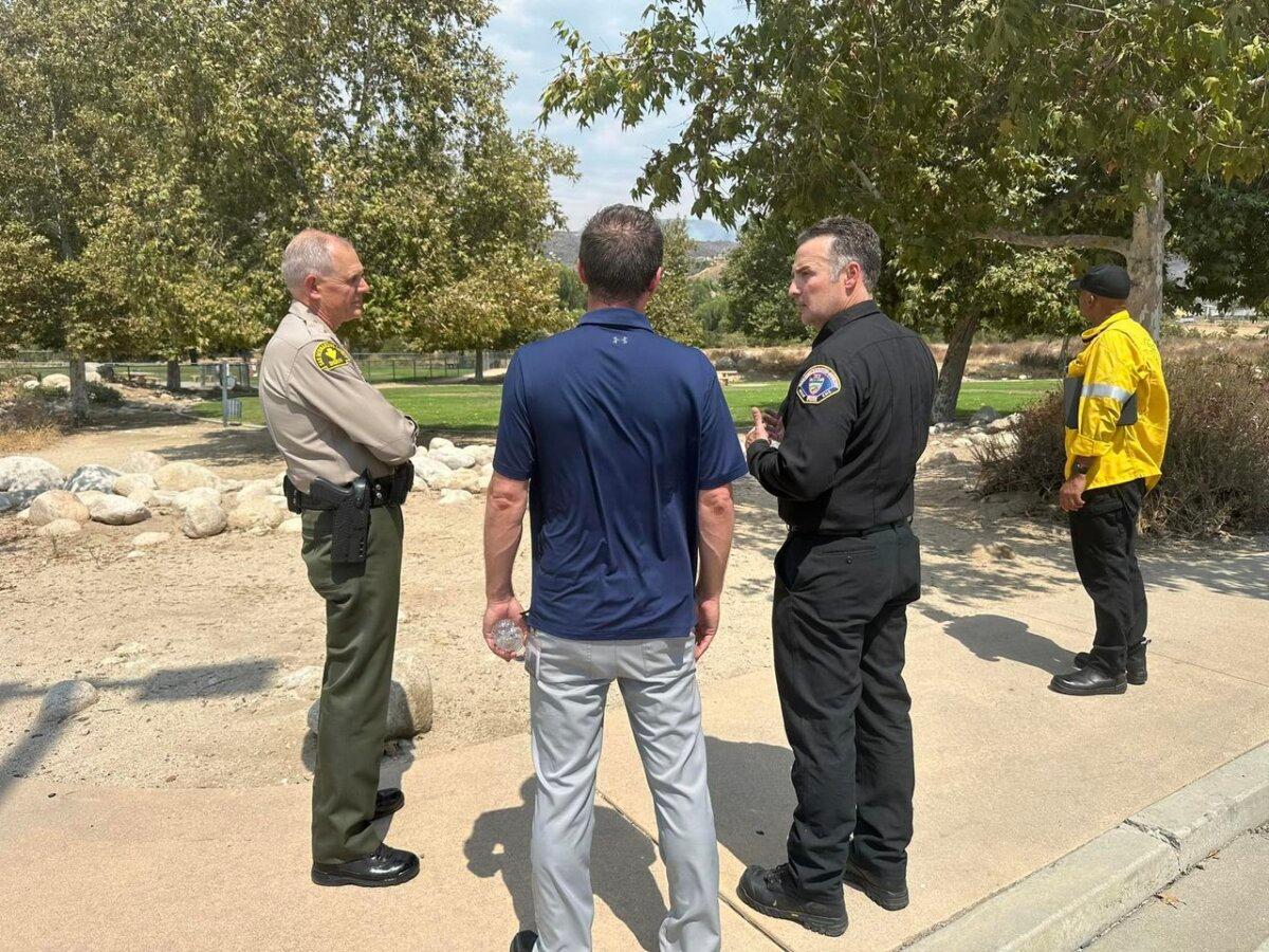 San Bernardino County Sheriff Shannon Dicus (L) meets with fire officials about the Line fire on Sept. 7, 2024. (U.S. Forest Service)