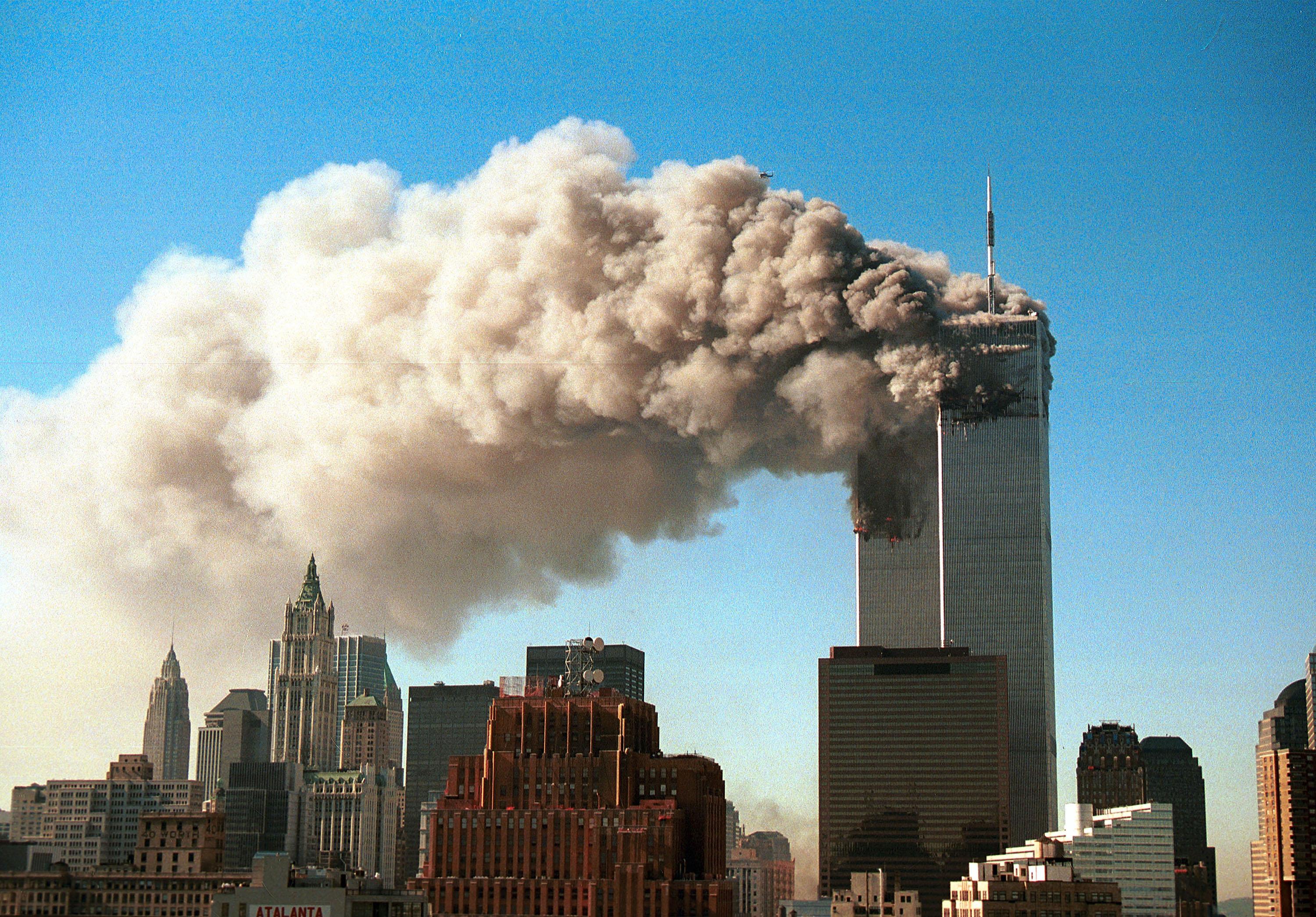 Smoke pours from the twin towers of the World Trade Center after they were hit by two airliners in a terrorist attack on Sept. 11, 2001, in New York City. (Robert Giroux/Getty Images)