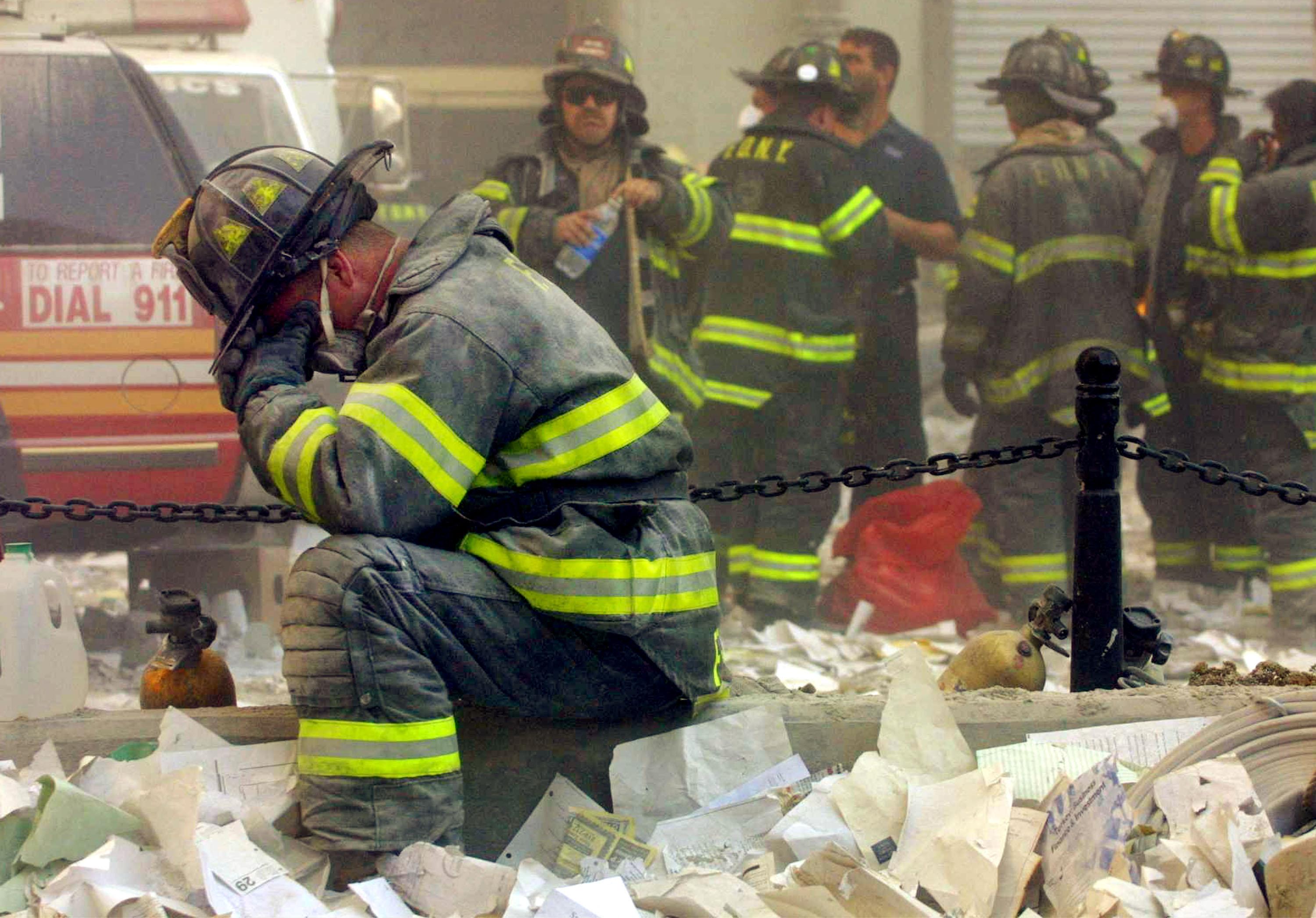 A firefighter prays after the World Trade Center buildings collapsed on Sept. 11, 2001. (Mario Tama/Getty Images)