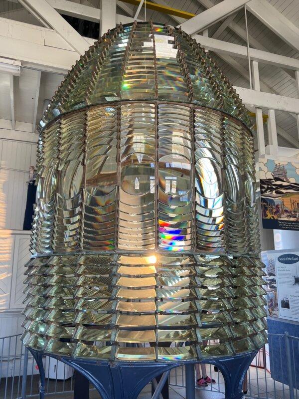 The first-order Fresnel lens is displayed inside the fog-signal building at Pigeon Point Lighthouse. (Courtesy of Karen Gough)