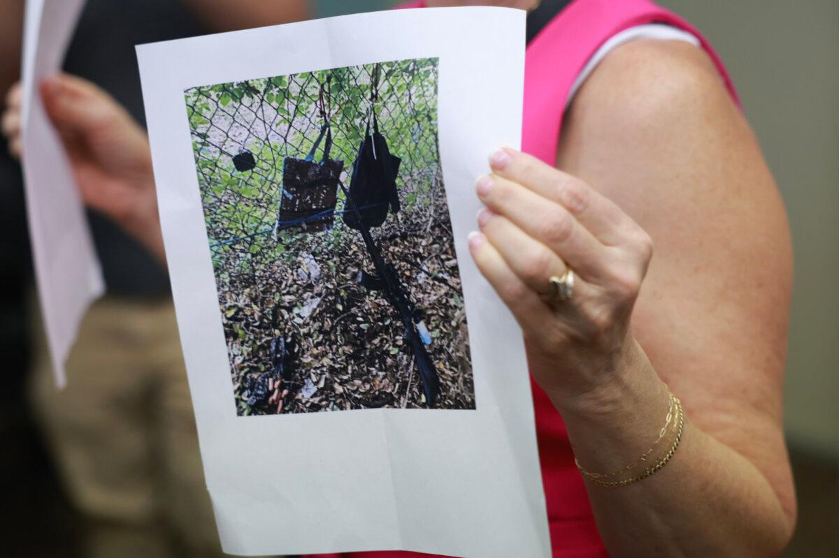 Palm Beach County Sheriff PIO Teri Barber holds a photograph of the rifle and other items found near where a suspect was discovered during a press conference regarding an apparent assassination attempt of former President Donald Trump on Sept. 15, 2024, in West Palm Beach, Florida. (Joe Raedle/Getty Images)