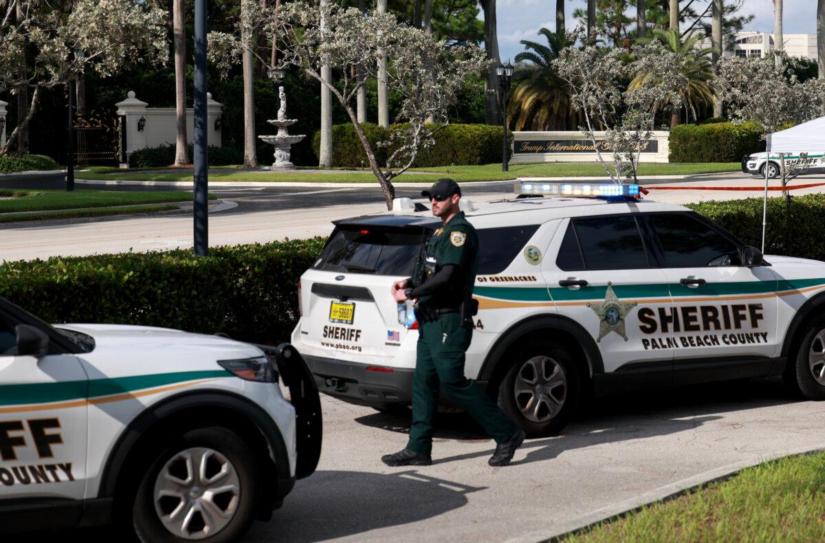 Law enforcement secures the area around Trump International Golf Club after an apparent assassination attempt of former President Donald Trump in West Palm Beach, Fla., on Sept. 15, 2024. (Joe Raedle/Getty Images)