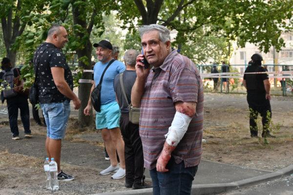 An injured local resident speaks on his mobile phone following a missile attack in Kharkiv on Sept. 15, 2024, amid the Russian invasion of Ukraine. (Sergey Bobok/AFP via Getty Images)