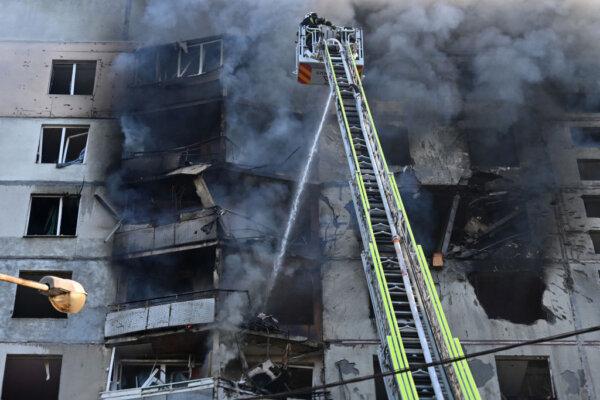 Ukrainian rescuers work to extinguish a fire in a residential building following a missile attack in Kharkiv on Sept. 15, 2024, amid the Russian invasion of Ukraine. (Sergey Bobok/AFP via Getty Images)