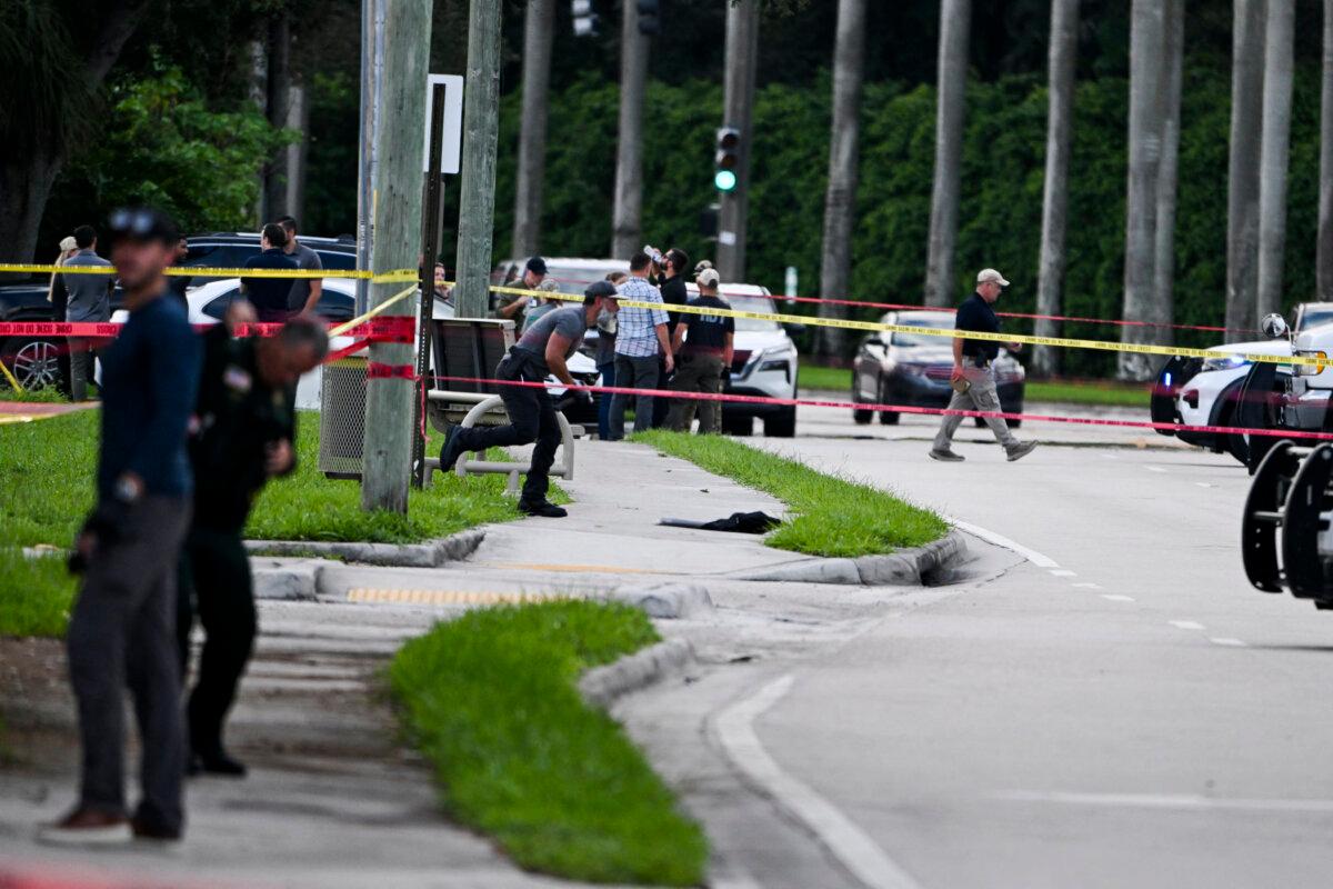 Members of FBI, Sheriff Department and Secret Service at the crime scene outside the Trump International Golf Club in West Palm Beach, Fla., on Sept. 15, 2024, following an apparent assassination attempt on former president Donald Trump. (Chandan Khanna/AFP via Getty Images)