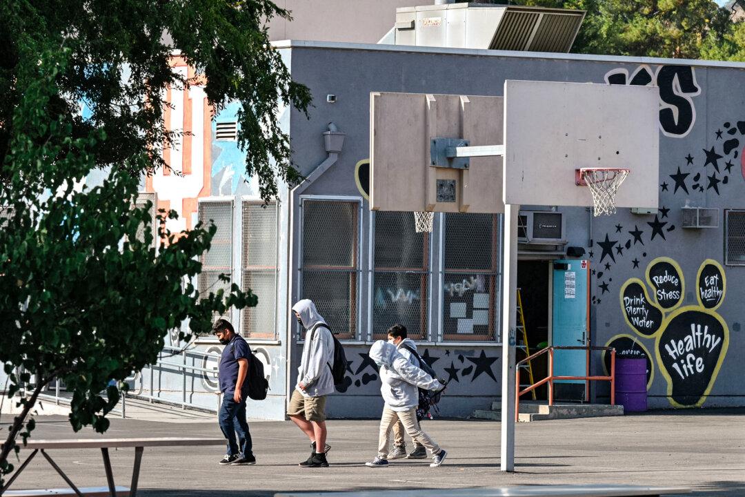 Students walk to their classrooms at a public middle school in Los Angeles on Sept. 10, 2021. (Robyn Beck/AFP via Getty Images)