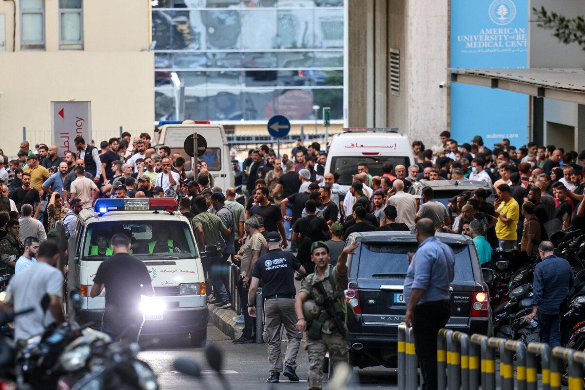 Ambulances are surrounded by people at the entrance of the American University of Beirut Medical Center after pager explosions hit locations in several Hezbollah strongholds around Lebanon amid ongoing cross-border tensions between Israel and Hezbollah fighters, in Beirut, Lebanon, on Sept. 17, 2024. (Anwar Amro/AFP via Getty Images)