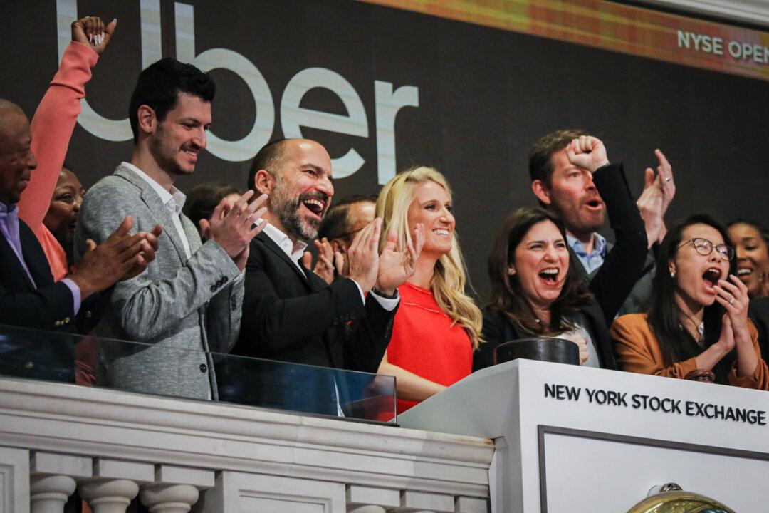 Uber CEO Dara Khosrowshahi (3rd L) joins his colleagues in ringing the Opening Bell at the New York Stock Exchange as the company makes its highly anticipated initial public offering (IPO) in New York City on May 10, 2019. Uber starts trading after raising $8.1 billion in the biggest U.S.-based IPO in five years. (Spencer Platt/Getty Images)