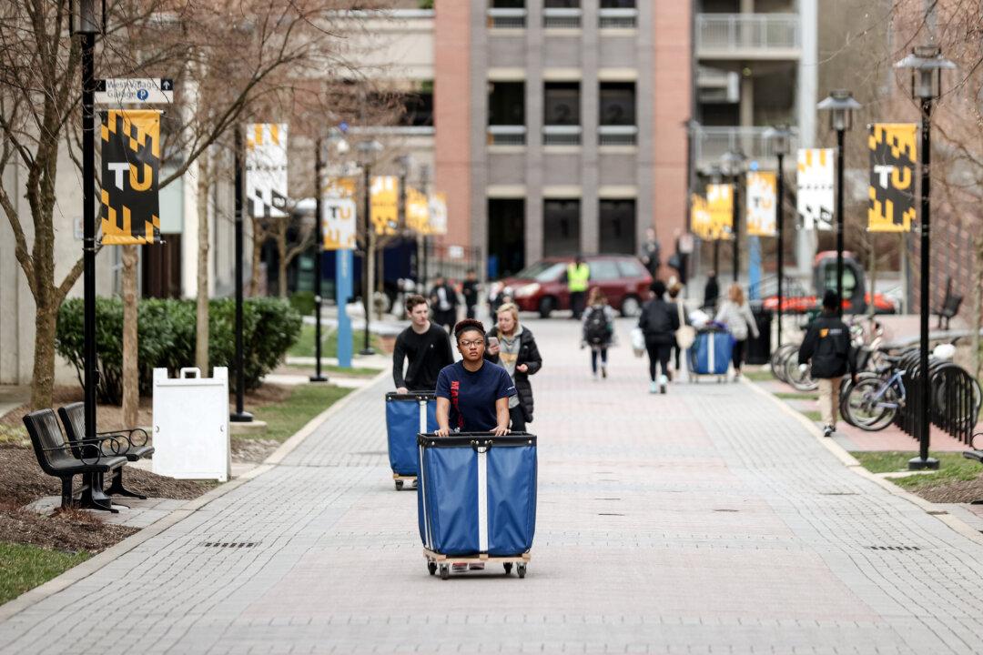 Students remove their belongings from their dorms before going on break. Many of the schools that have closed were financially underwater for years, according to Wadhwani. Temporary closures and federal aid only delayed the official closure. (Rob Carr/Getty Images)