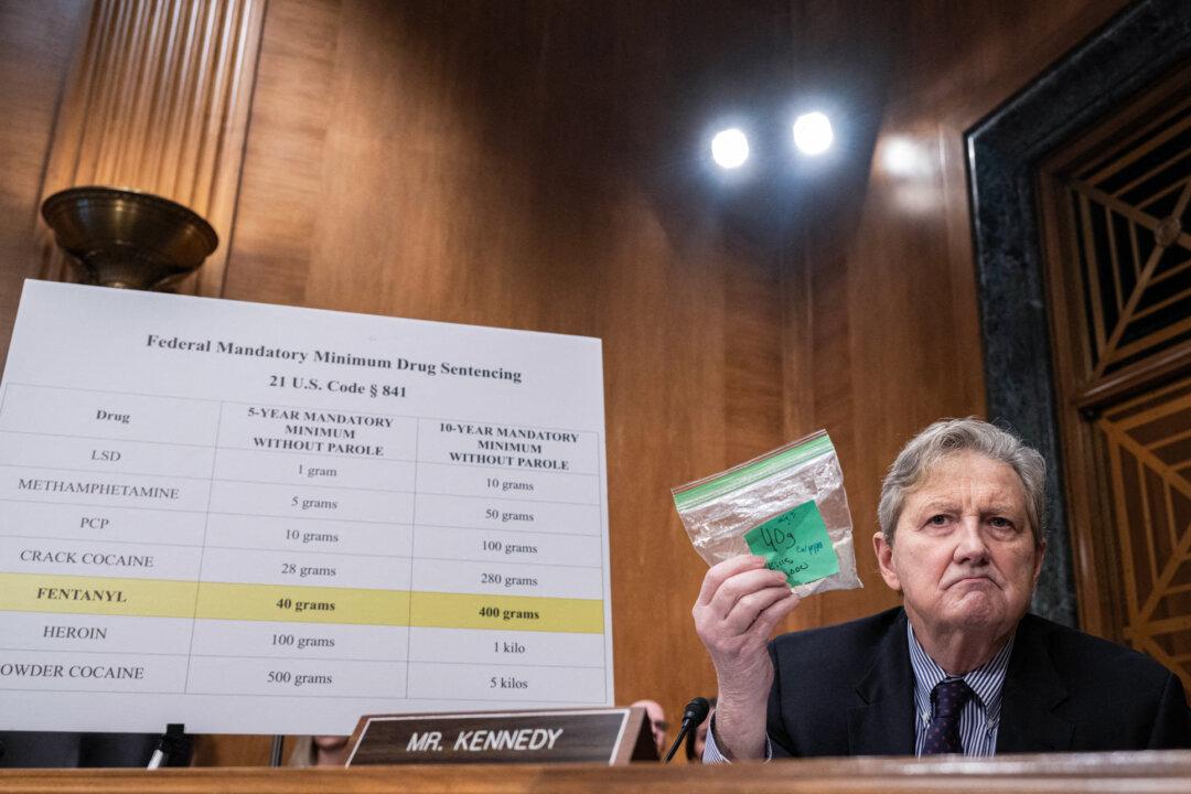 Sen. John Kennedy (R-La.) holds up a bag representing fentanyl during a hearing in Washington on Jan. 11, 2024. The hearing examined legislative solutions to stop the flow of fentanyl into and throughout the United States. (Andrew Caballero-Reynolds/AFP via Getty Images)