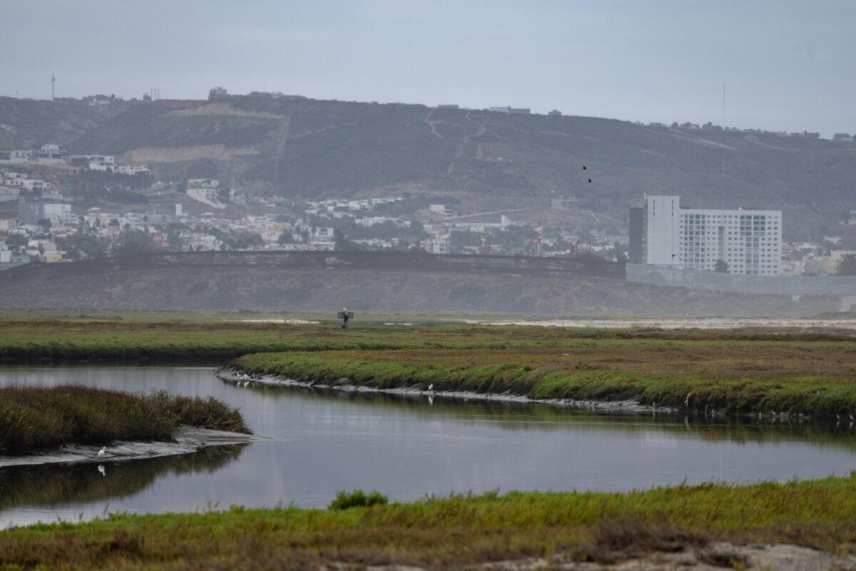 The Tijuana River flows within sight of the U.S.–Mexico border in Imperial Beach, Calif., on Sept. 19, 2024. (John Fredricks/The Epoch Times)