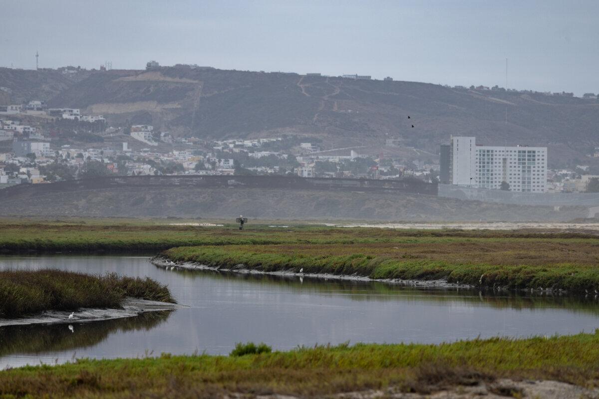 The Tijuana River flows within sight of the U.S.–Mexico border in Imperial Beach, Calif., on Sept. 19, 2024. (John Fredricks/The Epoch Times)