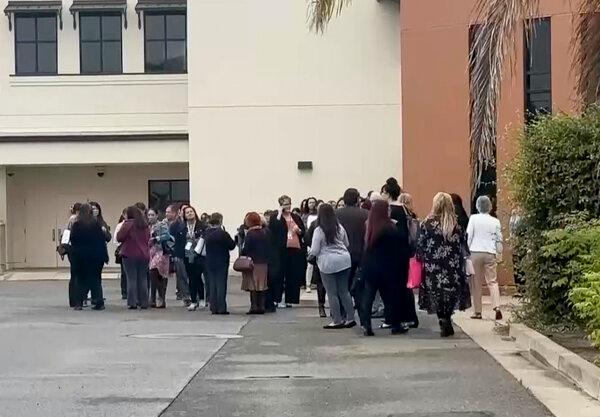 People gather following an explosion at the Santa Maria Courthouse in Santa Maria, Calif., on Sept. 25, 2024. (KEYT via AP)