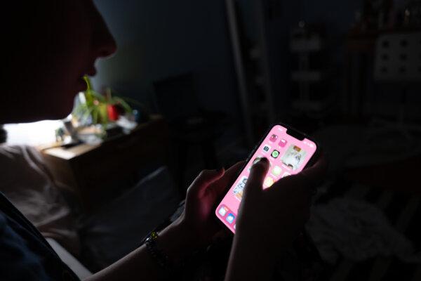 NEW YORK, NEW YORK - JANUARY 31: In this photo illustration, a teenager uses her mobile phone to access social media on January 31, 2024 in New York City. Technology executives appeared at a Senate hearing to address accusations that their companies are endangering children's lives by not adequately policing predators and others who seek to harm and exploit young social media users. (Photo illustration by Spencer Platt/Getty Images)