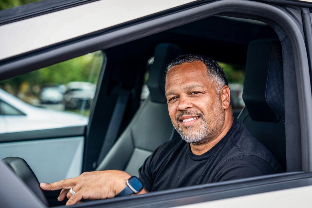 Russell, a behavioral health services provider, poses for a photo in his cybertruck in Greensboro, N.C., on Sept. 19, 2024. (Madalina Vasiliu/The Epoch Times)