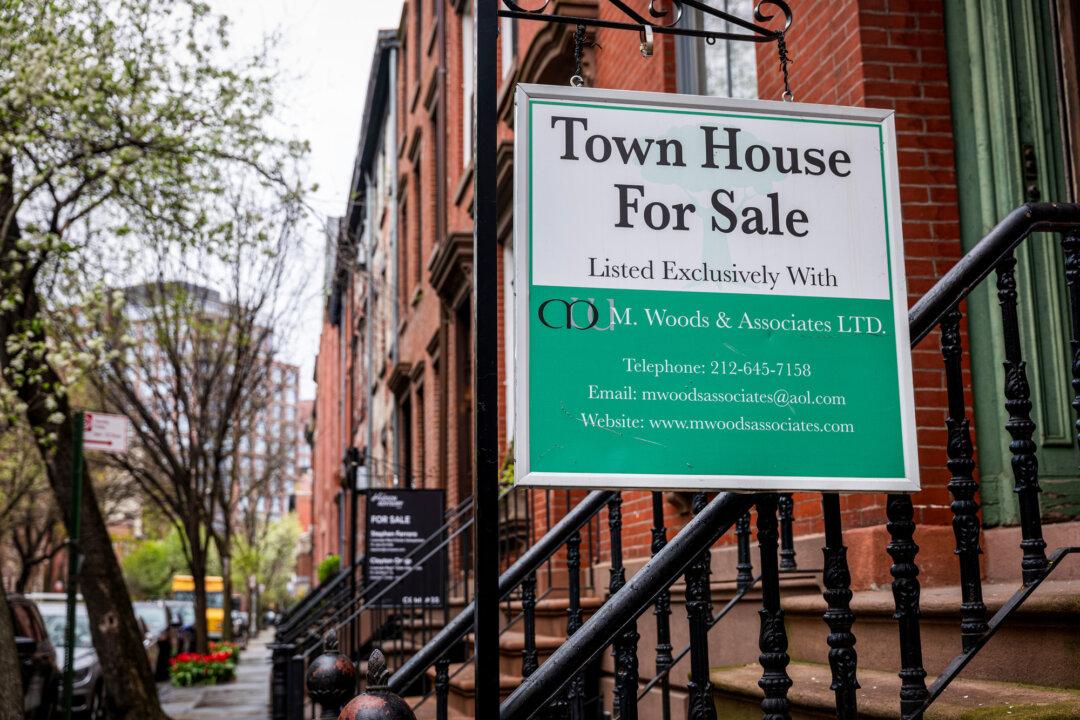 A sign advertising a home for sale is displayed outside of a Manhattan building in New York City on April 11, 2024 (Spencer Platt/Getty Images)