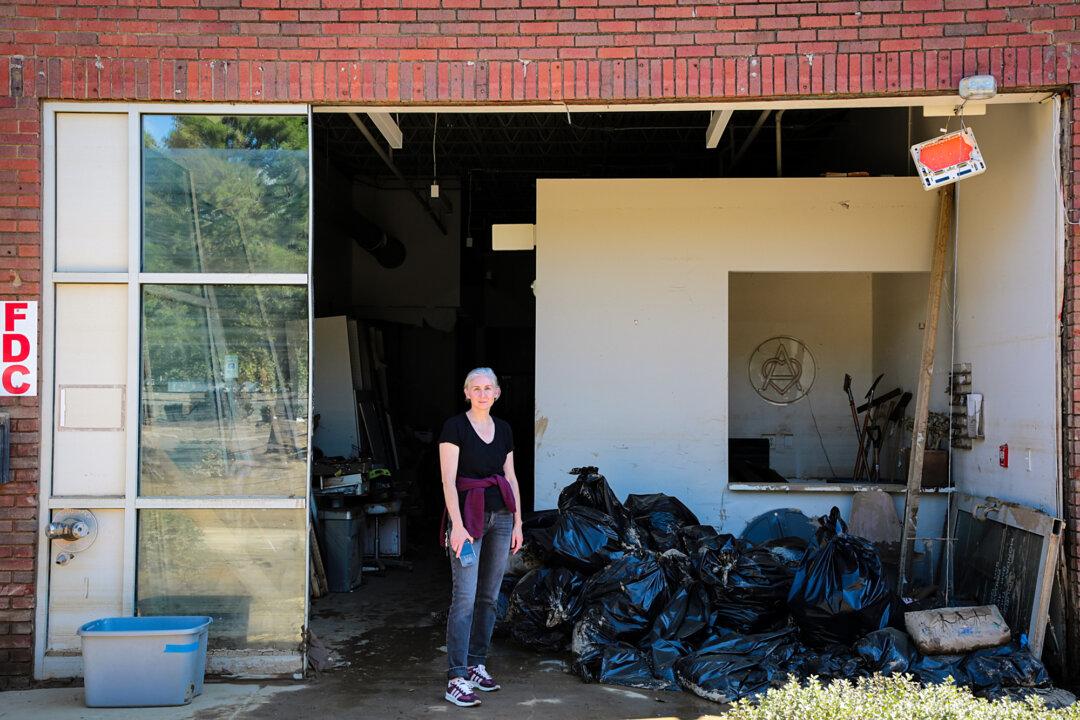 Dr. Carly Brown at her destroyed medical practice in the River Arts District of Asheville, N.C., on Oct. 2 and 3, 2024. (Richard Moore/The Epoch Times)