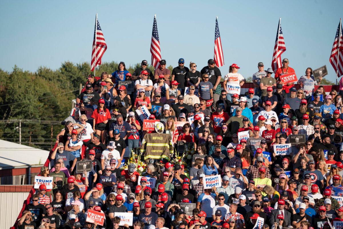 A firefighter's turnout gear marks the spot where Corey Comperatore was killed on July 13 during an attempted assassination on Republican presidential nominee, former President Donald Trump during campaign rally at the Butler Farm Show grounds in Butler, Pa., on Oct. 5, 2024. (Samira Bouaou/The Epoch Times)