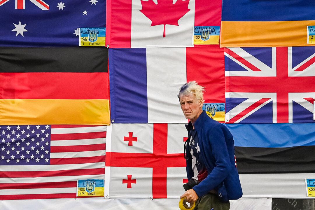 Ryan Wesley Routh stands in front of the national flags of countries that support Ukraine, on Independence Square in Kyiv, Ukraine, on June 23, 2022. (Sergei Supinsky/AFP via Getty Images)