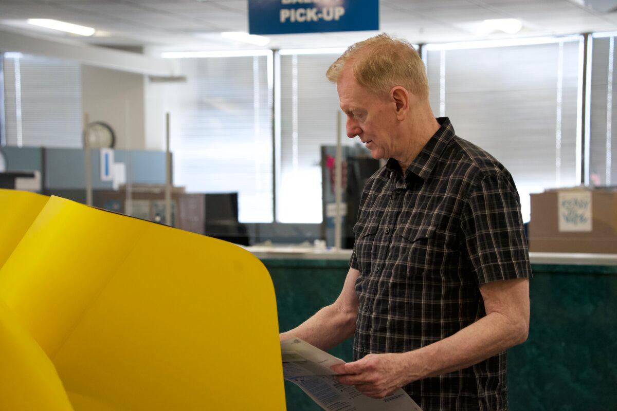 A voter casts his ballot at the Los Angeles County Registrar-Recorder/County Clerk in Norwalk, Calif., on Oct. 7, 2024. (Sophie Li/The Epoch Times)