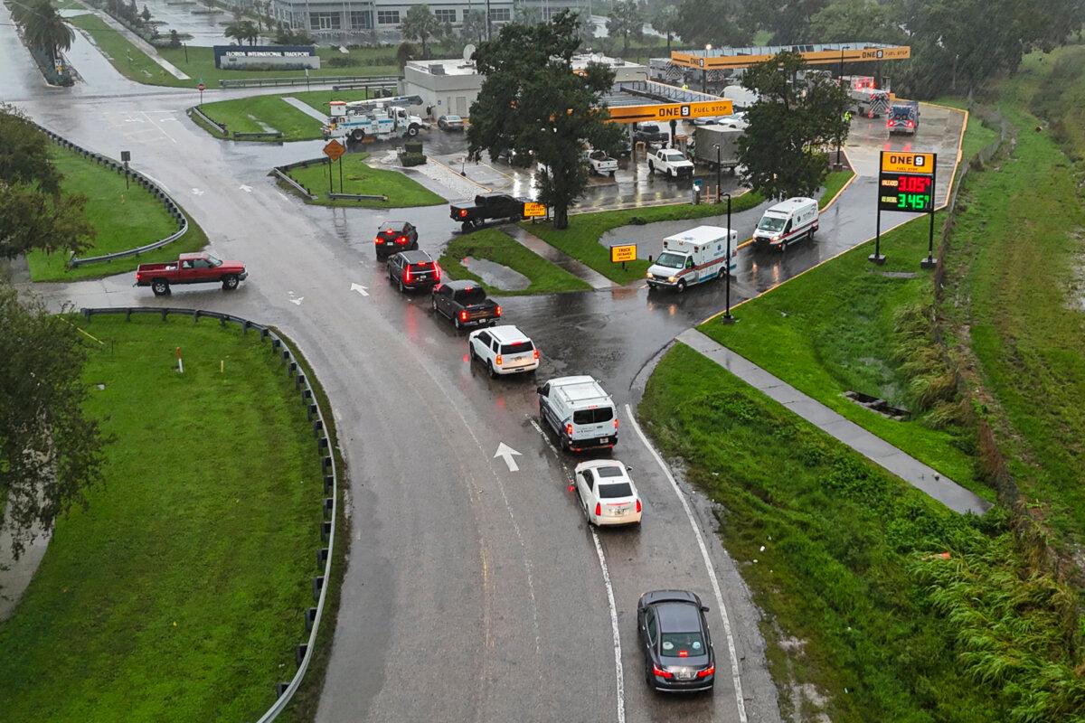 This drone picture shows people lining up in their cars for fuel at a gas station ahead of Hurricane Milton's expected landfall in Bradenton, Florida on Oct. 9, 2024. (Miguel J. Rodriguez Carrillo/AFP via Getty Images)