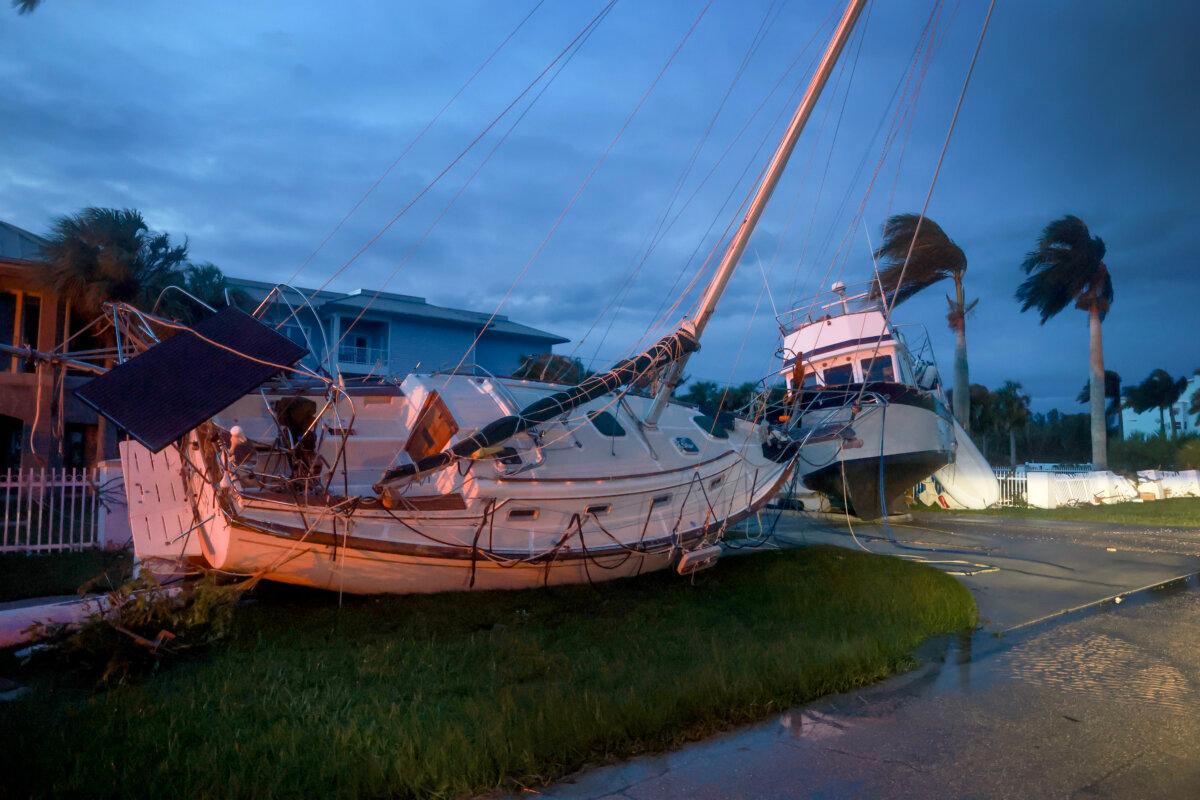 Boats rest in a yard after they were washed ashore when Hurricane Milton passed through the area in Punta Gorda, Fla., on Oct. 10, 2024. (Joe Raedle/Getty Images)