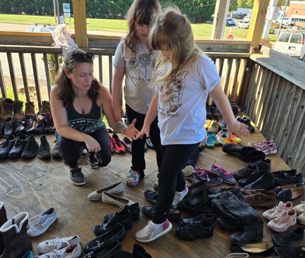 Keisha Grubbs looks for new shoes for her two daughters in Black Mountain, N.C., on Oct. 8, 2024. (Allan Stein/The Epoch Times)