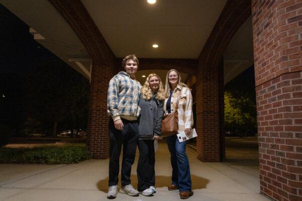 Ryder Shaw (L), Alaina Tumminelli (C), and Ashley Anderson (R) cast their ballots in Apex, N.C., on Oct. 17, 2024. (John Fredricks/The Epoch Times)