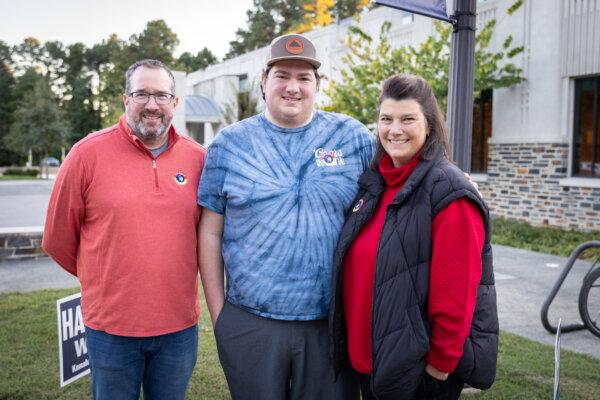 Tim, Noah, and Kelli Mason voted in Durham, N.C., on Oct. 17, 2024. (John Fredricks/The Epoch Times)