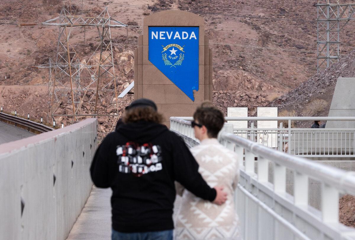 People walk near the Hoover Dam outside of Boulder City, Nev., on Oct. 19, 2024. (John Fredricks/The Epoch Times)