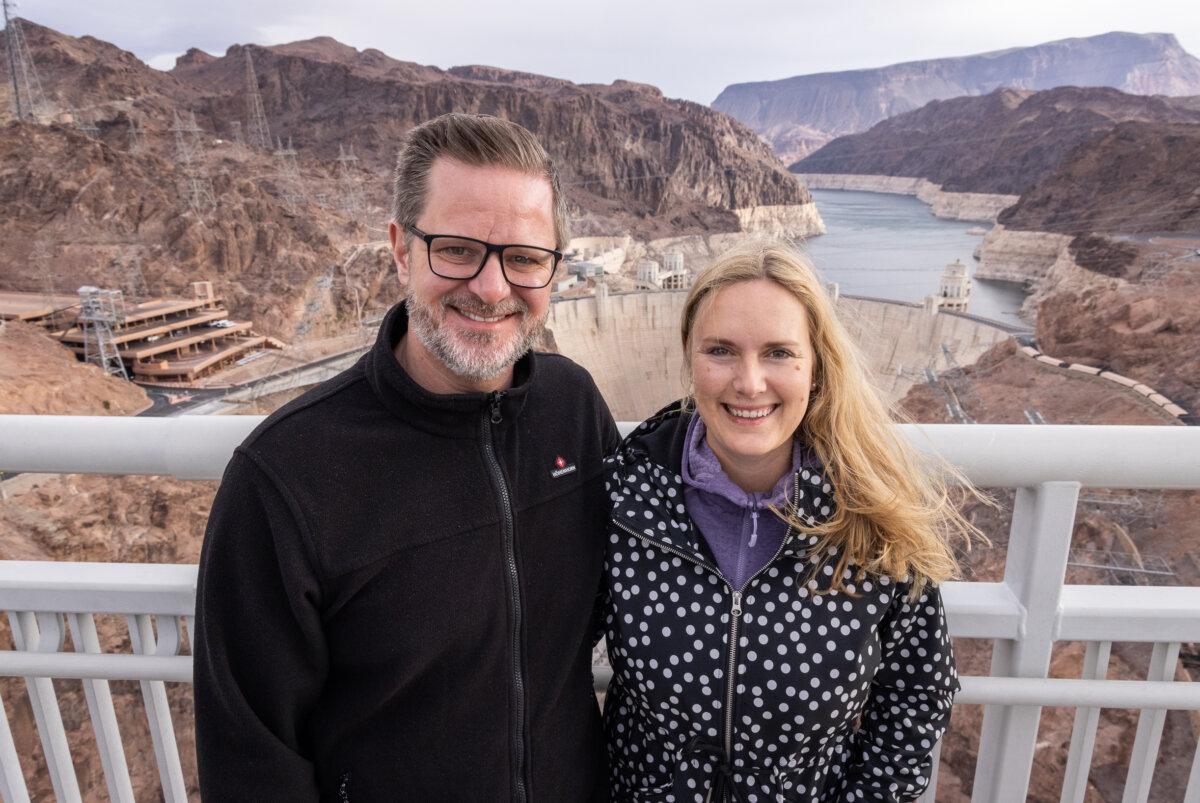 Peter and Karina Mechel, tourists from Nuremberg, Germany, stand together near the Hoover Dam outside of Boulder City, Nev., on Oct. 19, 2024. (John Fredricks/The Epoch Times)