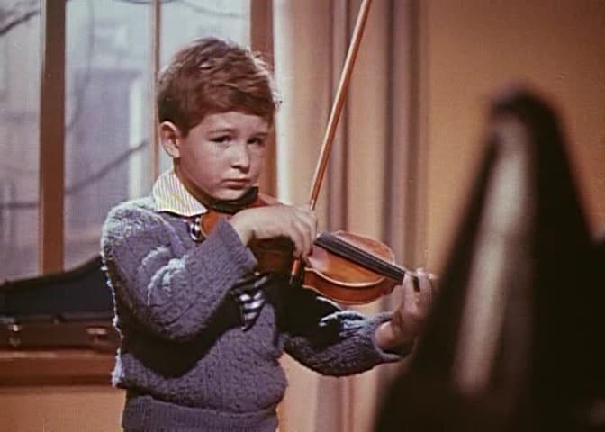 Although he loves to play his instrument, Sasha (Igor Fomchenko) is saddened by his tough practice regime, in “The Steamroller and the Violin.” (Criterion Collection)