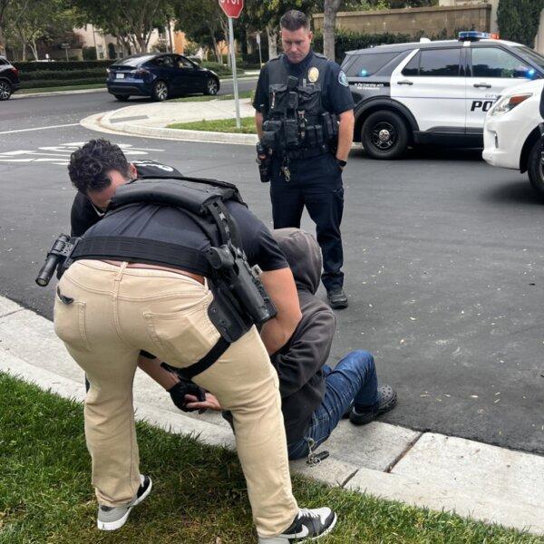 A man is arrested in Irvine, Calif., on Oct. 16 after fliers were found on neighborhood cars advertising prostitution. (Irvine Police Department)