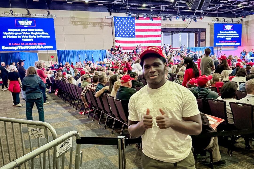 Nazir Mbami, a 17-year-old voter who will turn 18 before Election Day, attends former President Donald Trump's town hall event in Lancaster, Pa., on Oct. 20, 2024. (Arjun Singh/The Epoch Times)