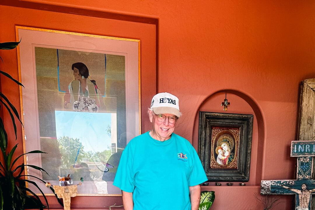 Harris supporter Ruben Smith, a former mayor and New Mexico state representative, poses for a photo with his dog at his home in Las Cruces, N.M., on Oct. 5, 2024. (Darlene McCormick Sanchez/The Epoch Times)