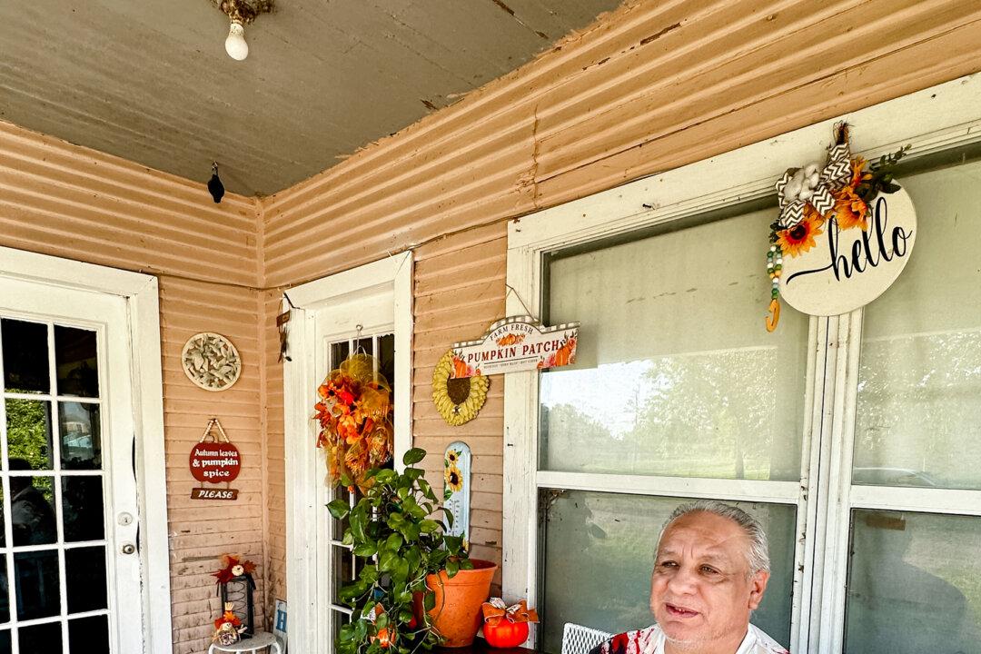 Ernesto Alonzo Chapa sits on his porch and discuss why he supports Vice President Kamala Harris for president, in Kingsville, Texas, on Sept. 30. 2024. (Darlene McCormick Sanchez/The Epoch Times)