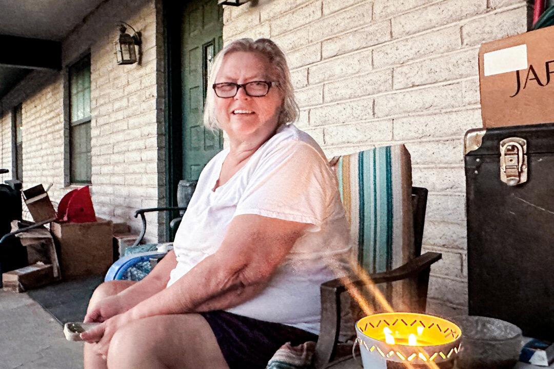 Trump Supporter Susan Seggerman, a retired veteran, sits on her porch north of Las Cruces, N.M., on Oct. 2, 2024. (Darlene McCormick Sanchez/The Epoch Times)