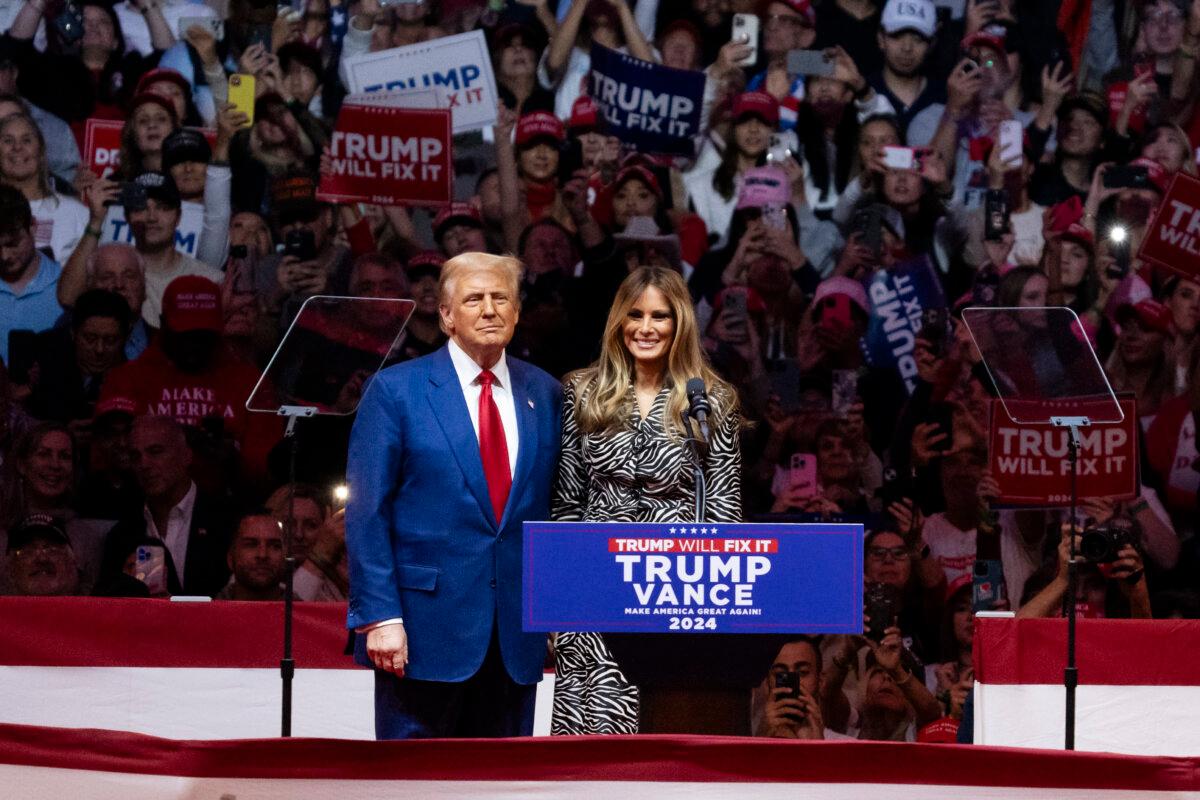 Former President Donald Trump and former First Lady Melania Trump take the stage for a campaign rally at Madison Square Garden in New York City on Oct. 27, 2024. (Samira Bouaou/The Epoch Times)