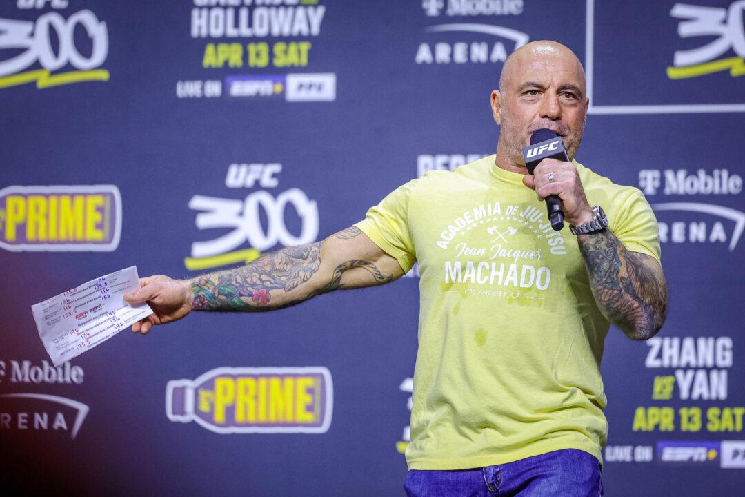 Joe Rogan at the UFC 300 ceremonial weigh-in at MGM Grand Garden Arena in Las Vegas on April 12, 2024. Rogan's podcast has a predominantly young male audience. (Carmen Mandato/Getty Images)