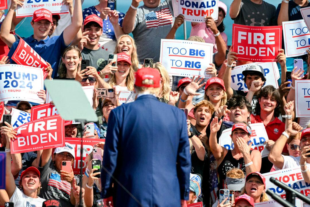 Trump supporters cheer as the former president arrives to speak at a campaign event in Racine, Wis., on June 18, 2024. (Jim Watson/AFP via Getty Images)