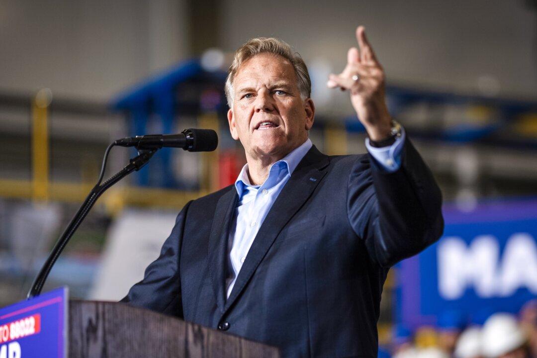 (Left) Rep. Elissa Slotkin (D-Mich.) speaks during the final day of the Democratic National Convention in Chicago on Aug. 22, 2024. (Right) Former Rep. Mike Rogers (R-Mich.) speaks at a Trump campaign event in Walker, Mich., on Sept. 27, 2024. (Chip Somodevilla/Getty Images, Scott Olson/Getty Images)