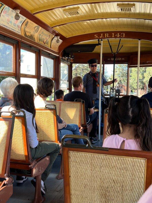 The conductor introduces Trolley Car No. 143 to visitors at History Park, San Jose. (Courtesy of Karen Gough)