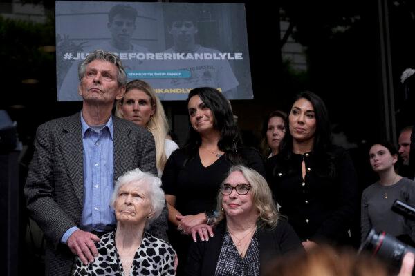 Kitty Menendez's sister, Joan Andersen VanderMolen, bottom left, and niece Karen VanderMolen, right, sit together during a press conference to announce developments on the case of brothers Erik and Lyle Menendez, in Los Angeles on Oct. 16, 2024. (Damian Dovarganes/AP Photo)