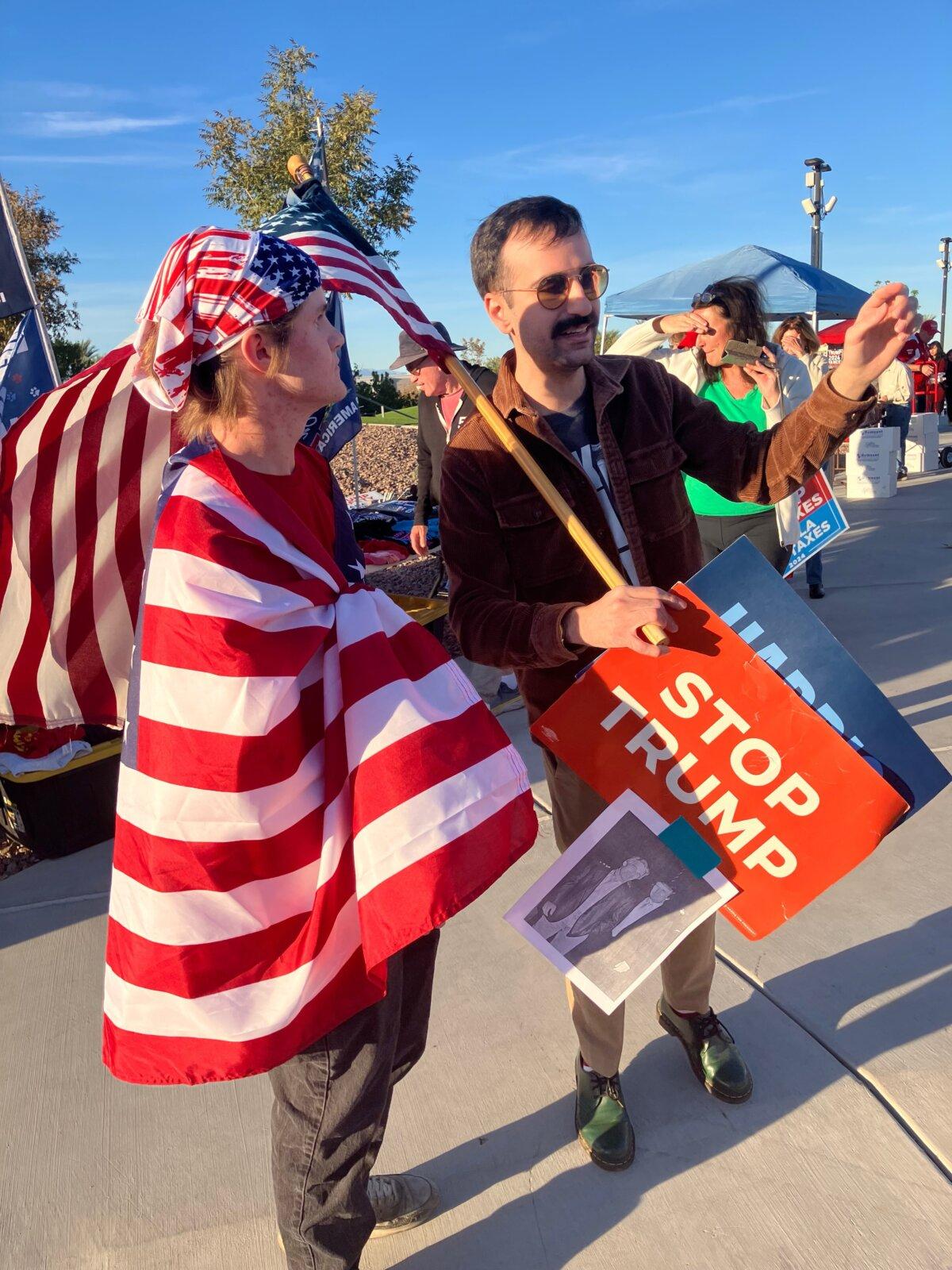 Trump supporter Ryan Molldenhauer (L) and an anti-Trump demonstrator at the former president's Oct. 31 rally in Henderson, Nevada--debate the finer points of the upcoming Nov. 5 general election.(John Haughey/The Epoch Times)