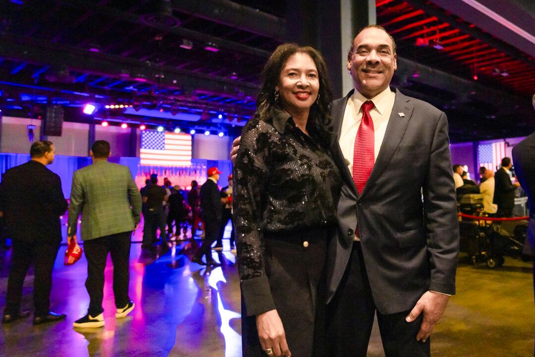 Bruce LeVell, the national diversity coordinator for former President Donald Trump, stands with his wife Sharon LeVell at the former president's election night watch party in West Palm Beach, Fla., on Nov. 5, 2024. (John Fredricks/The Epoch Times)