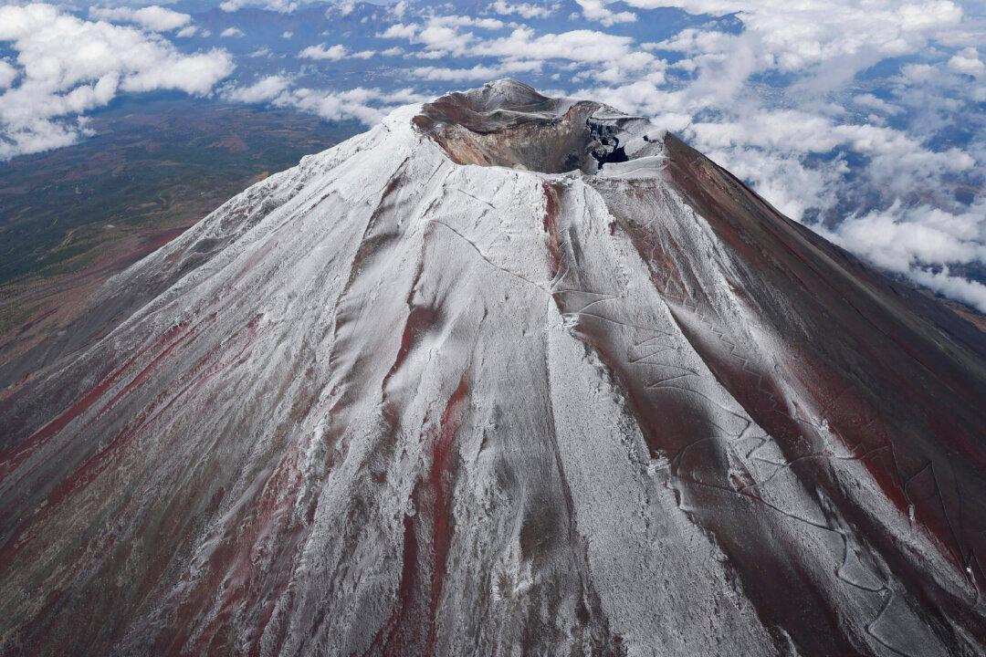 Mt. Fuji in Japan is covered with snow on Nov. 6, 2024. (Kyodo News via AP)