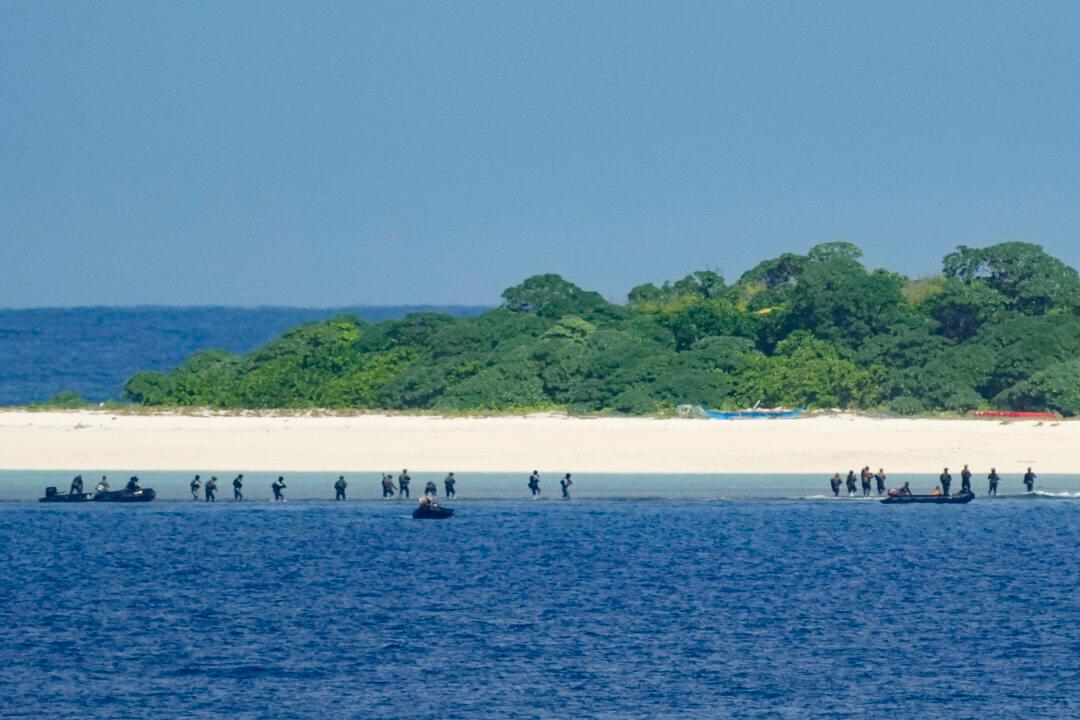 Philippine troopers seize an island from foreign forces during a Philippine military multi-service joint exercise on Loaita island locally called Kota island at the disputed South China Sea, Philippines, on Nov. 6, 2024. (Aaron Favila/AP Photo)